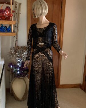 1930s black sheer lace evening gown set with matching cropped lace jacket displayed on mannequin against neutral backdrop