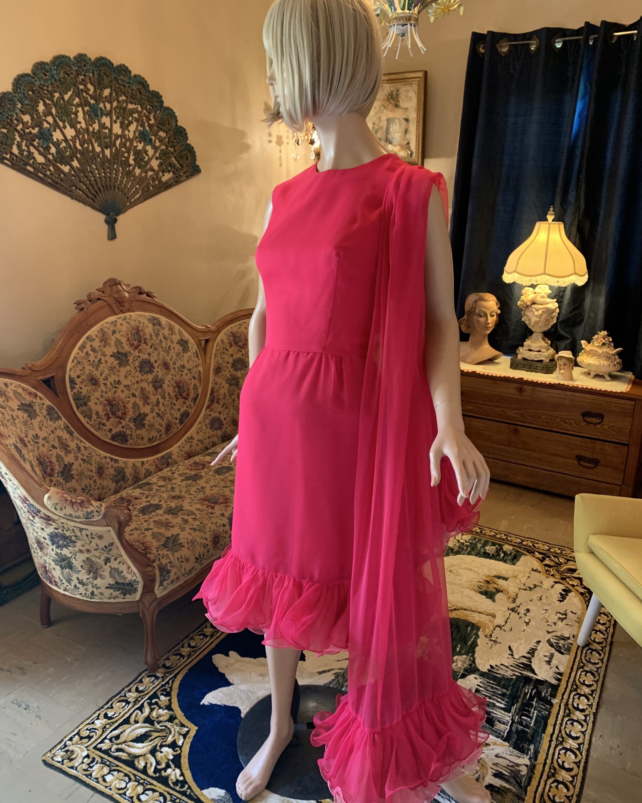 Miss Elliette hot pink sleeveless cocktail dress with matching chiffon scarf, angled front view