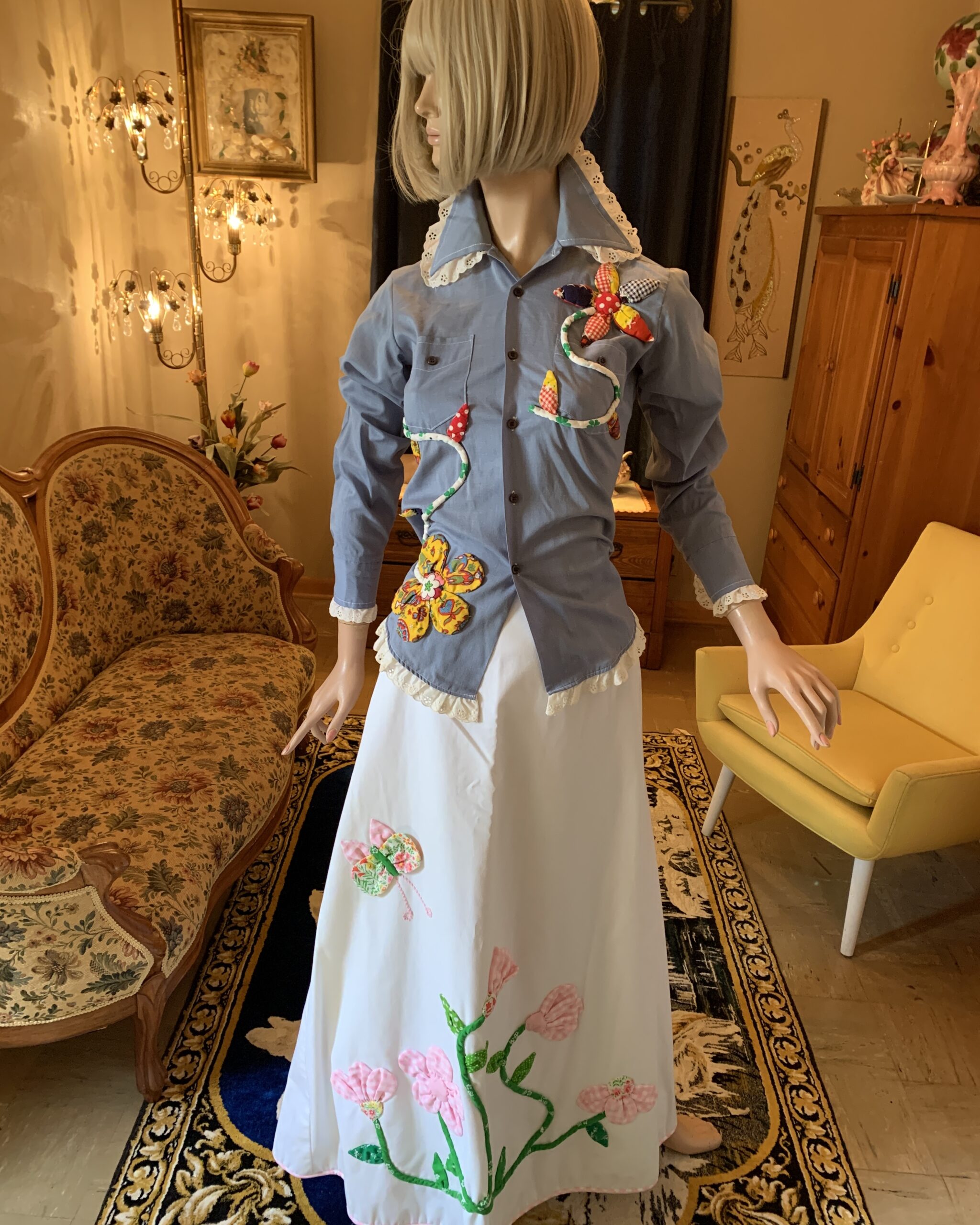 Vintage Catherine Carr white maxi skirt with dimensional pink gingham floral appliqués, green vine details, and a colorful butterfly near the hip.