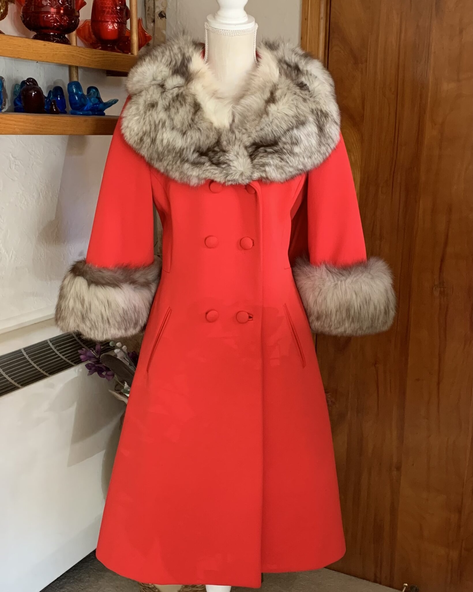 Vintage Lilli Ann red wool coat with gray fur collar and fur-trimmed cuffs, double-breasted silhouette and mid-length A-line shape.