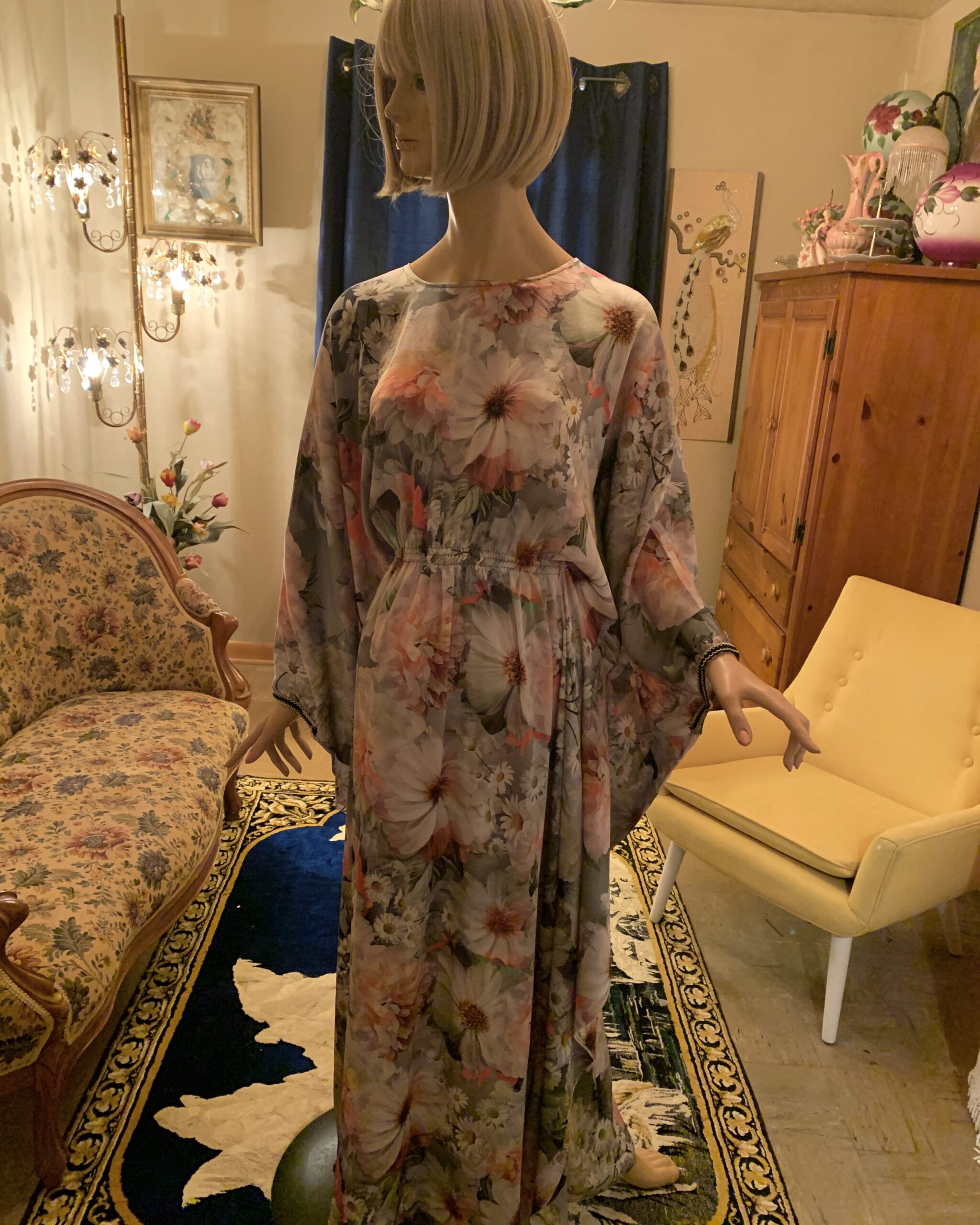 Vintage floral butterfly sleeve maxi dress in a soft gray print with oversized pink and white flowers, shown from the front.