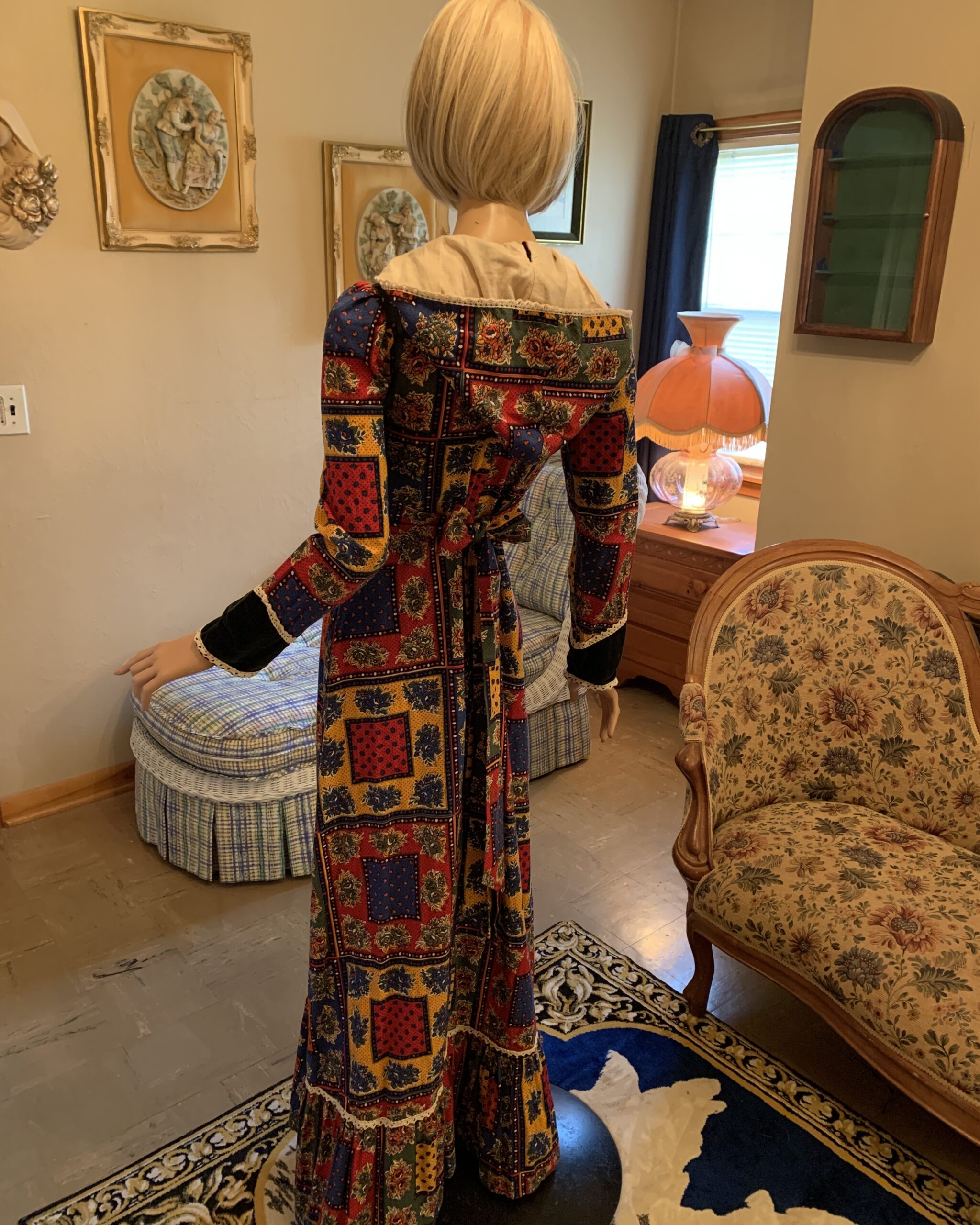 Back view of vintage patchwork prairie maxi dress with attached waist ties and hood