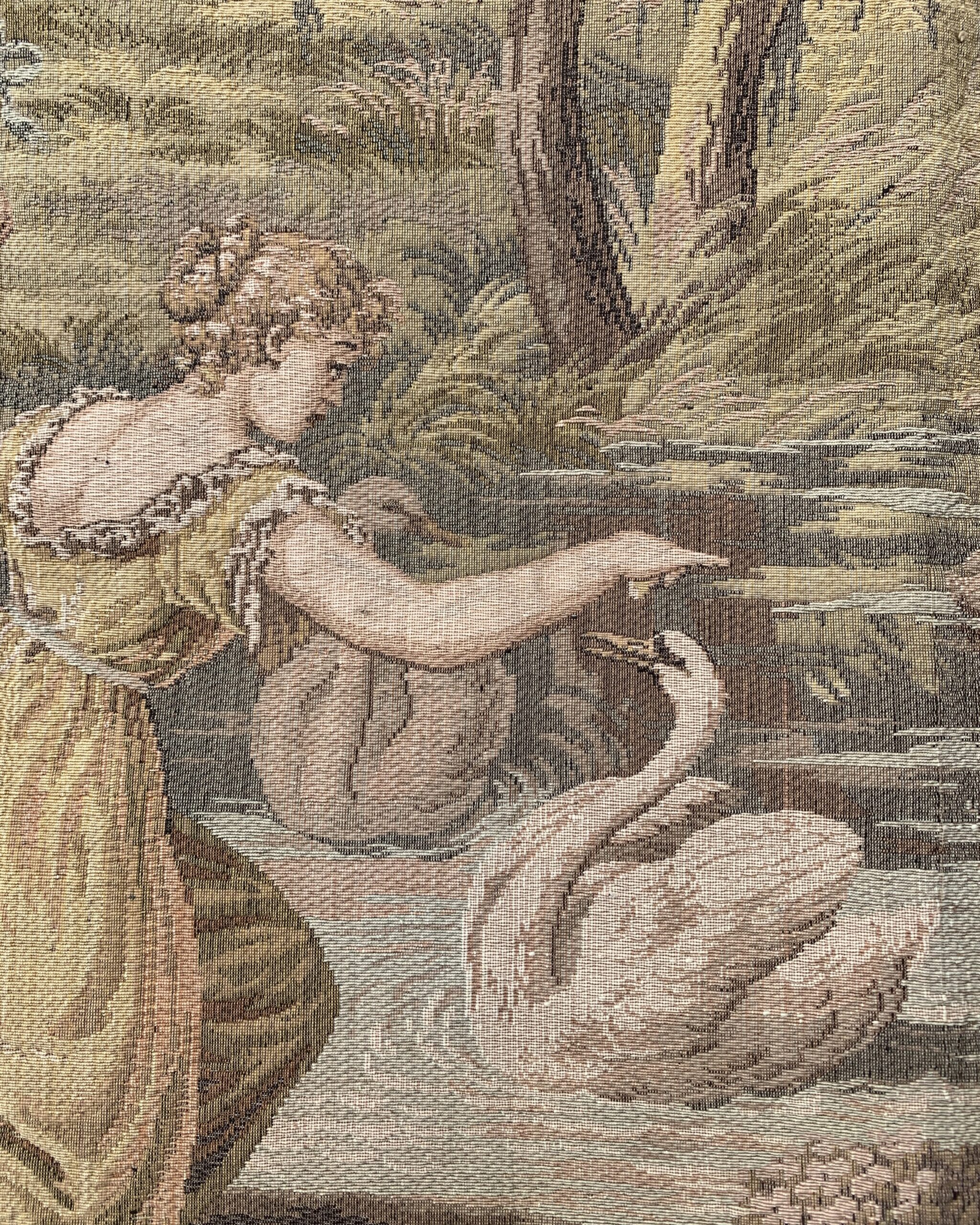 Close-up of a woven swan beside a female figure in a romantic pastoral tapestry scene.