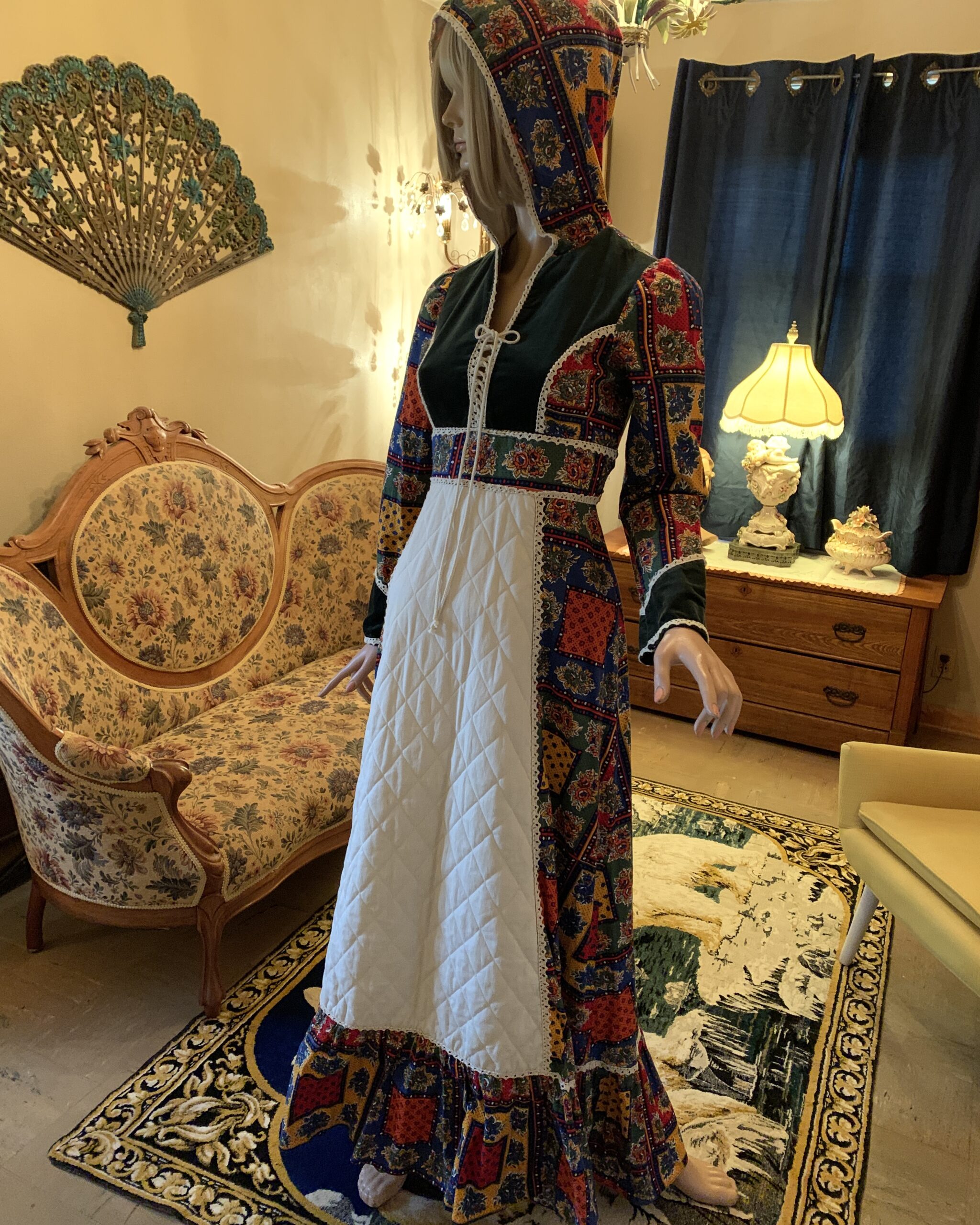 1970s prairie dress with matching hood, patchwork floral print, and quilted apron front