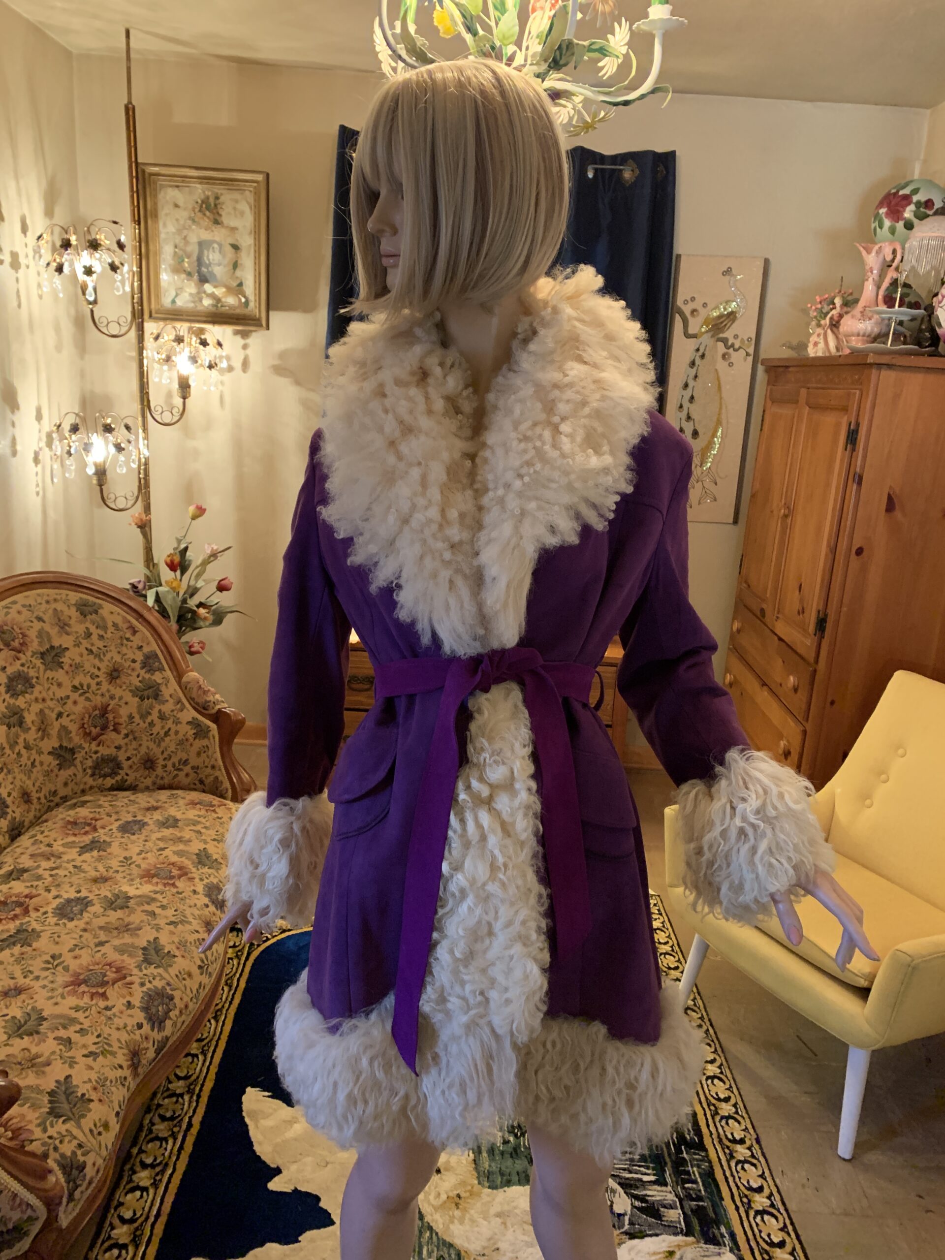 Vintage Lilli Ann purple coat with cream curly shearling trim, self-tie belt, patch pockets, and Made in England label, photographed in the salon.