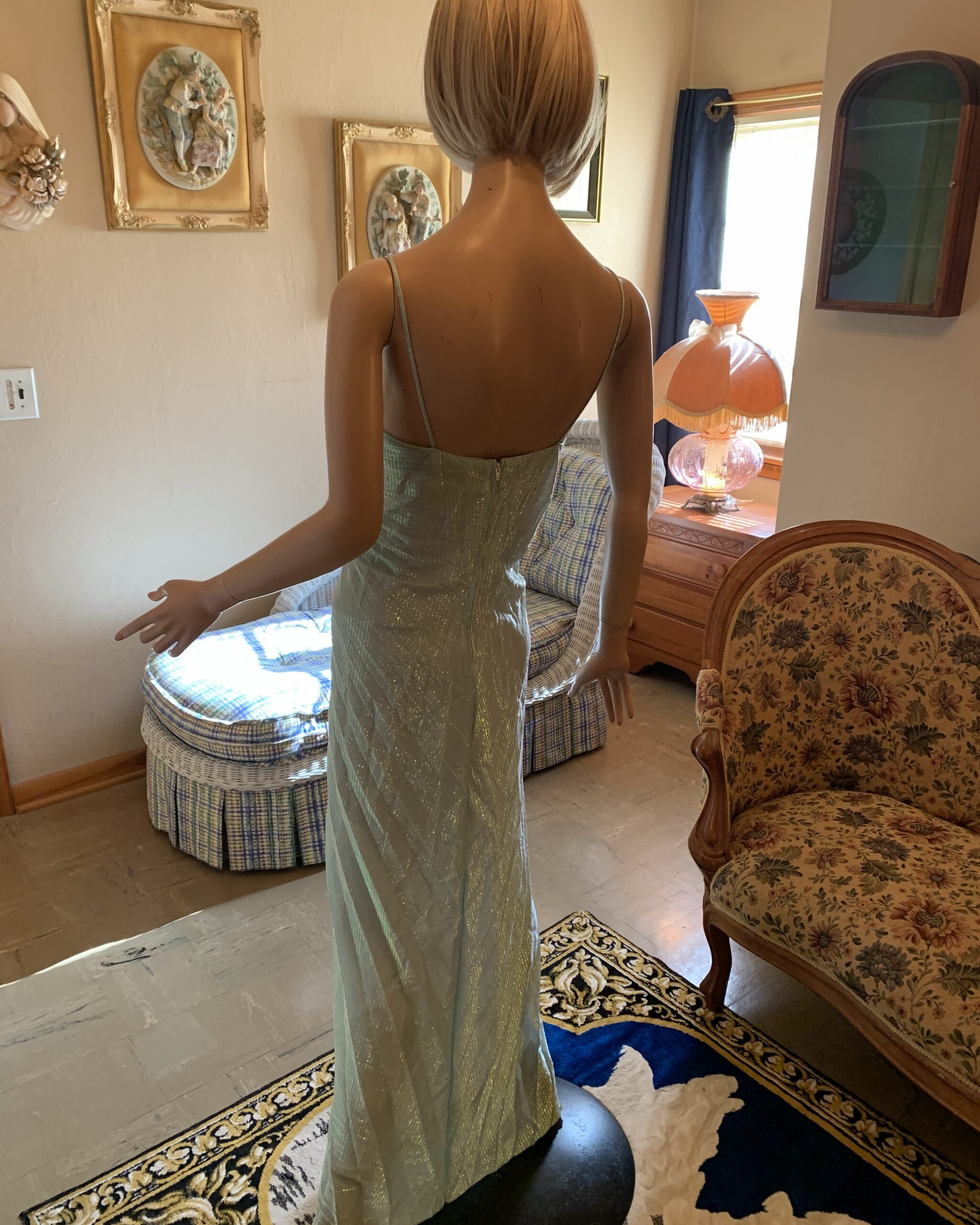 Back view of 1960s New Leaf by Samir seafoam metallic evening gown with low back, slender straps, and fitted column silhouette.