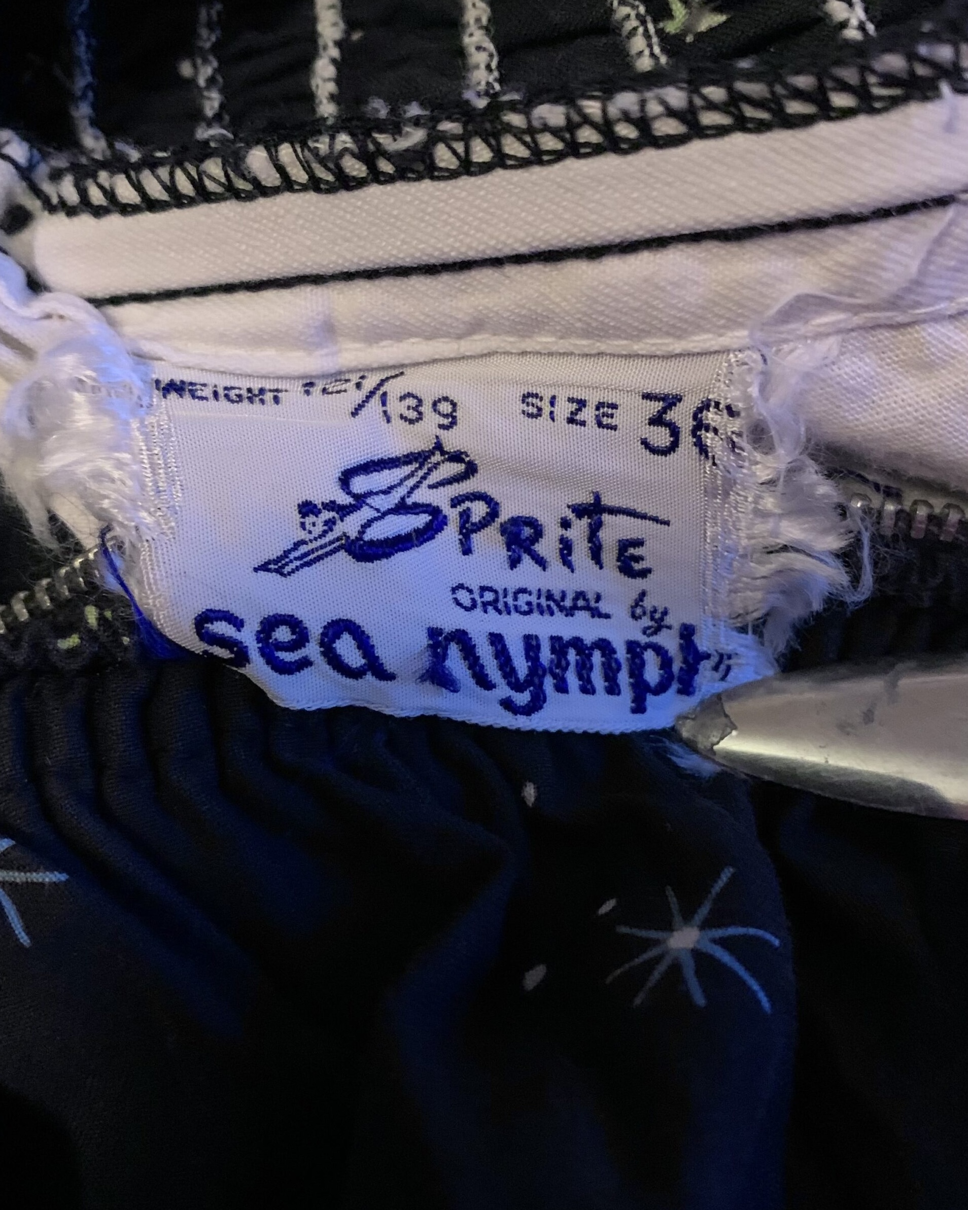 Original Sea Nymph label inside vintage celestial novelty print swimsuit, size 36.