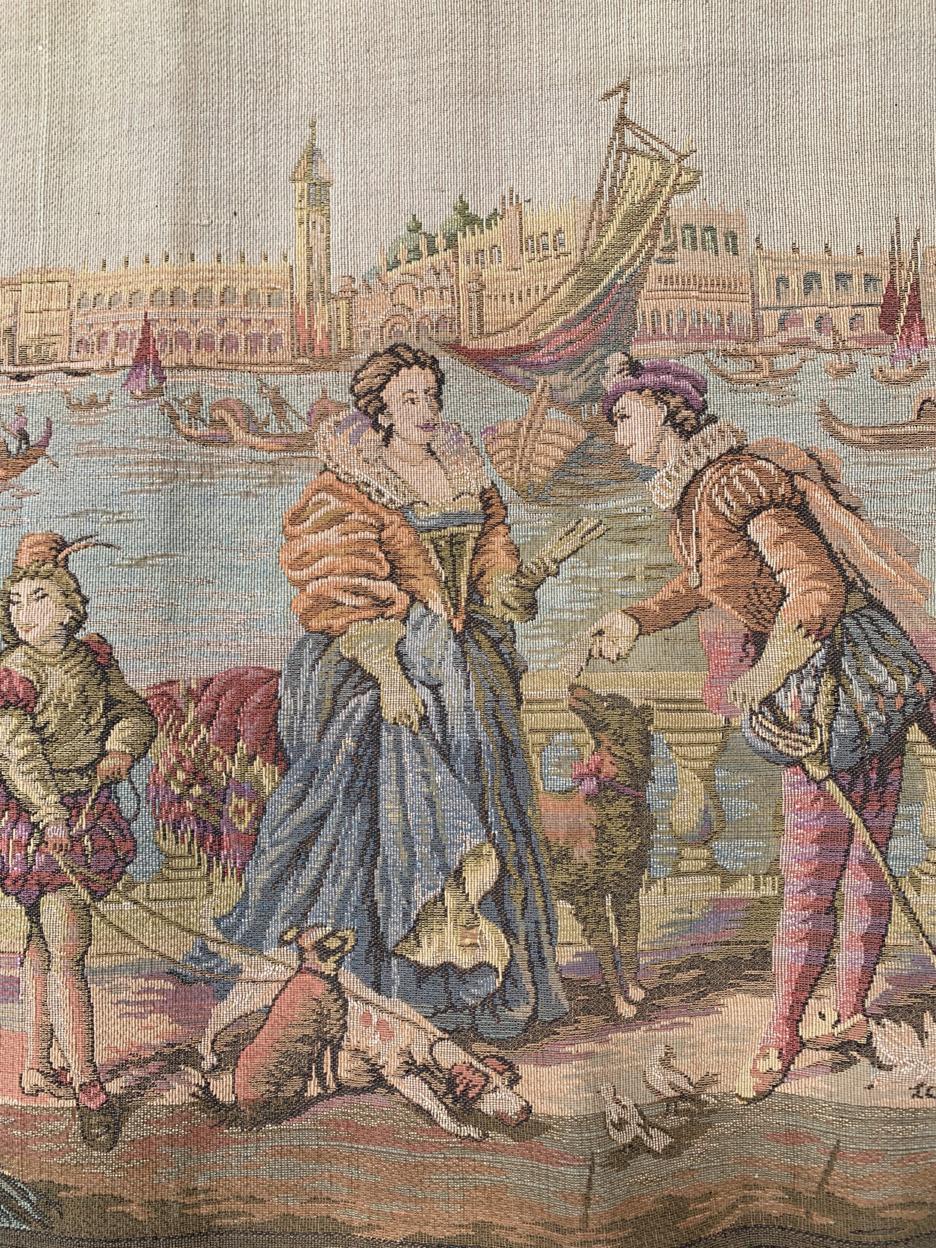 Detail of Venetian harbor tapestry showing finely dressed figures, dogs, and waterfront promenade in a romantic European scene.