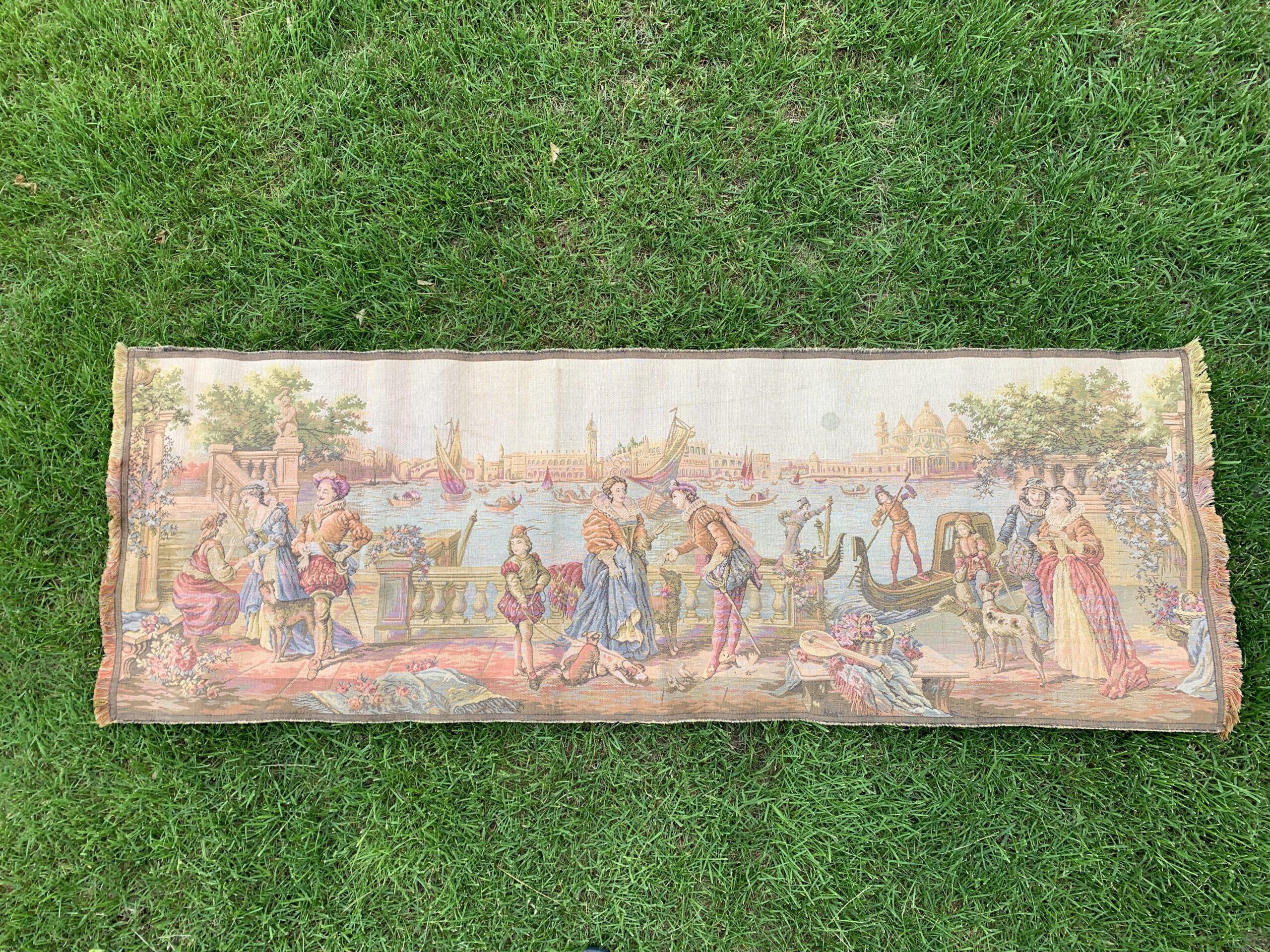 Mid-century European woven tapestry runner depicting an elegant Venetian harbor scene with figures, gondolas, and classical architecture.