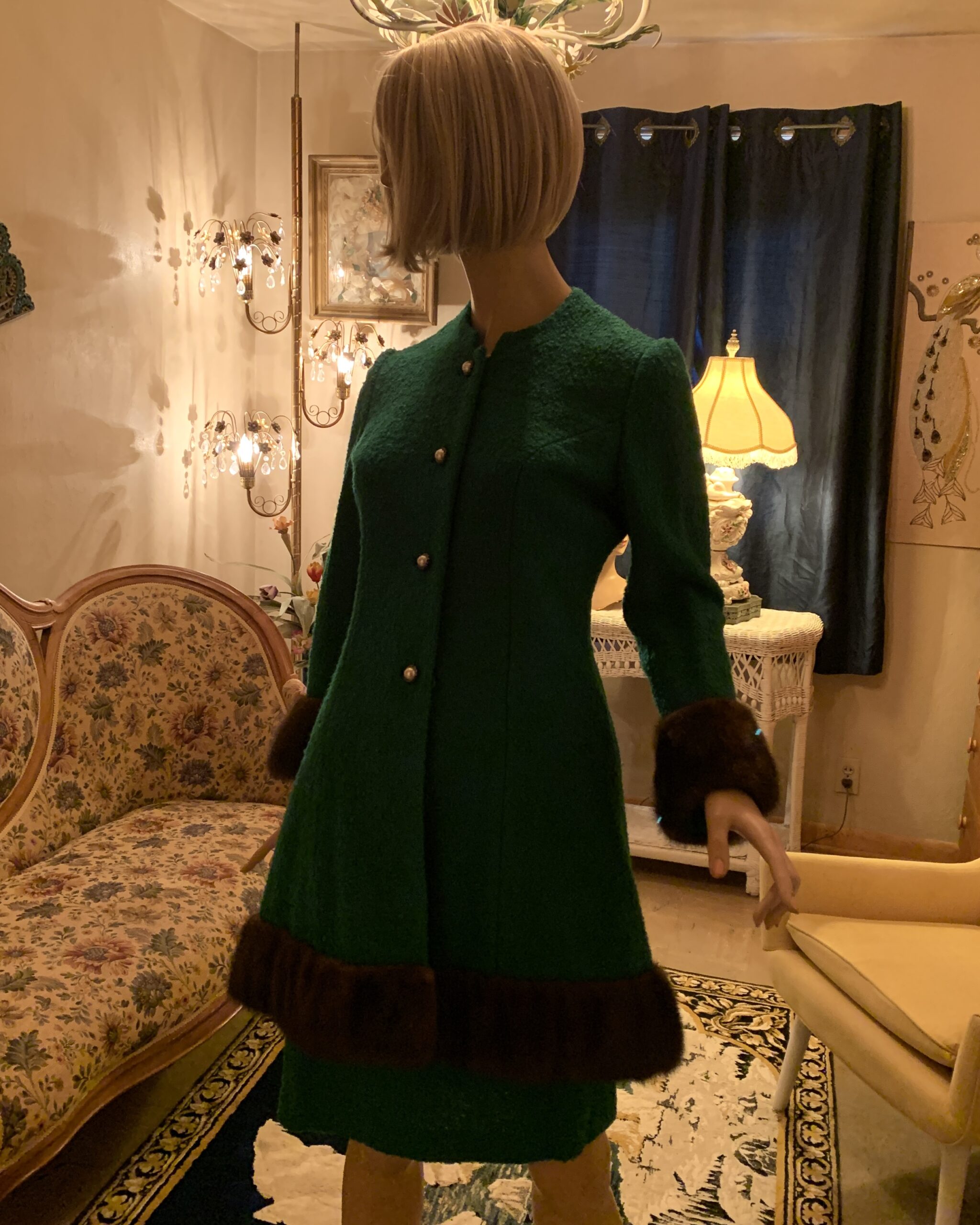Vintage Lilli Ann San Francisco emerald green wool coat dress with dark brown mink fur trim, pearlized buttons, and a fitted mid-century silhouette displayed on a mannequin.