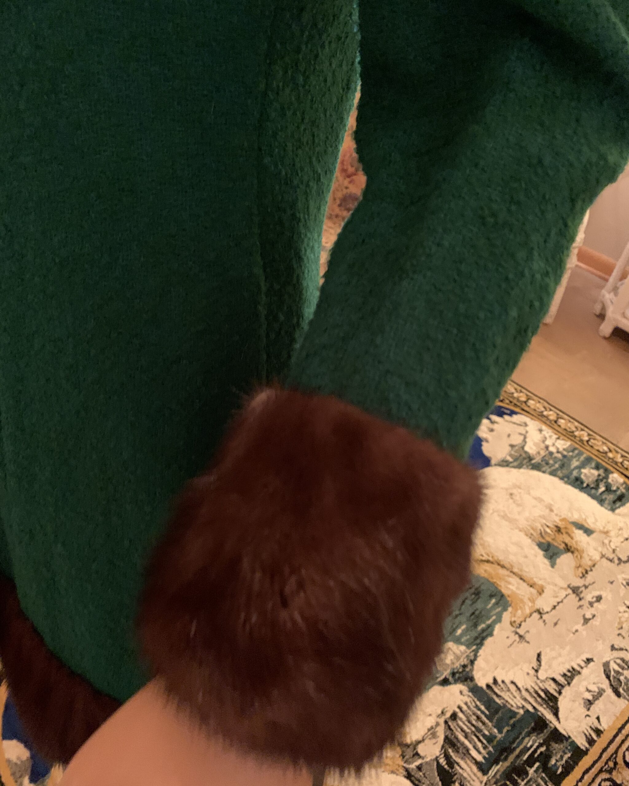 Close-up of the dark brown mink fur cuff on a vintage Lilli Ann emerald green wool coat dress, showing the soft texture and tailored wool fabric.