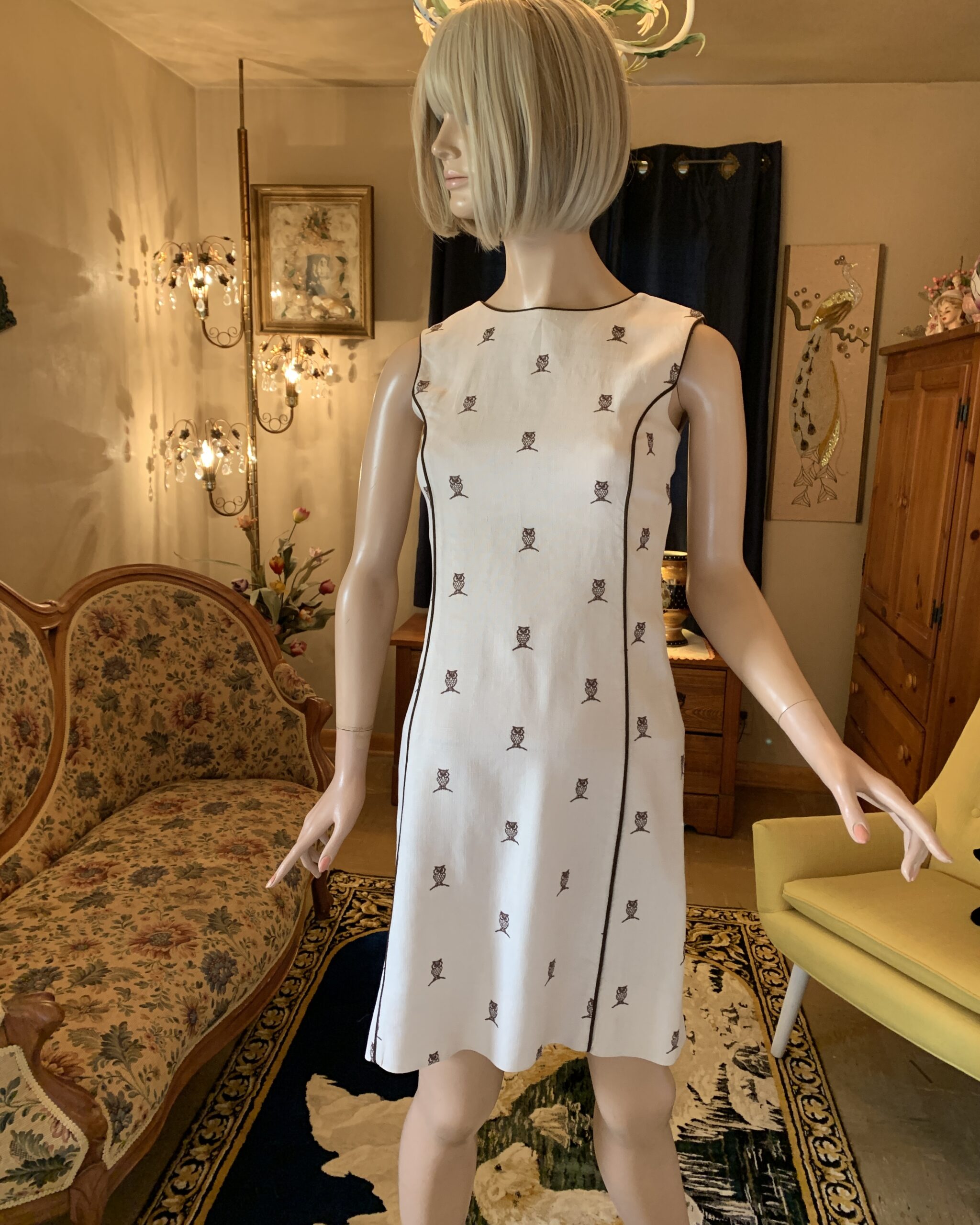 1960s House of Lords owl print shift dress in cream linen blend with brown novelty owl motif and contrast piping detail.