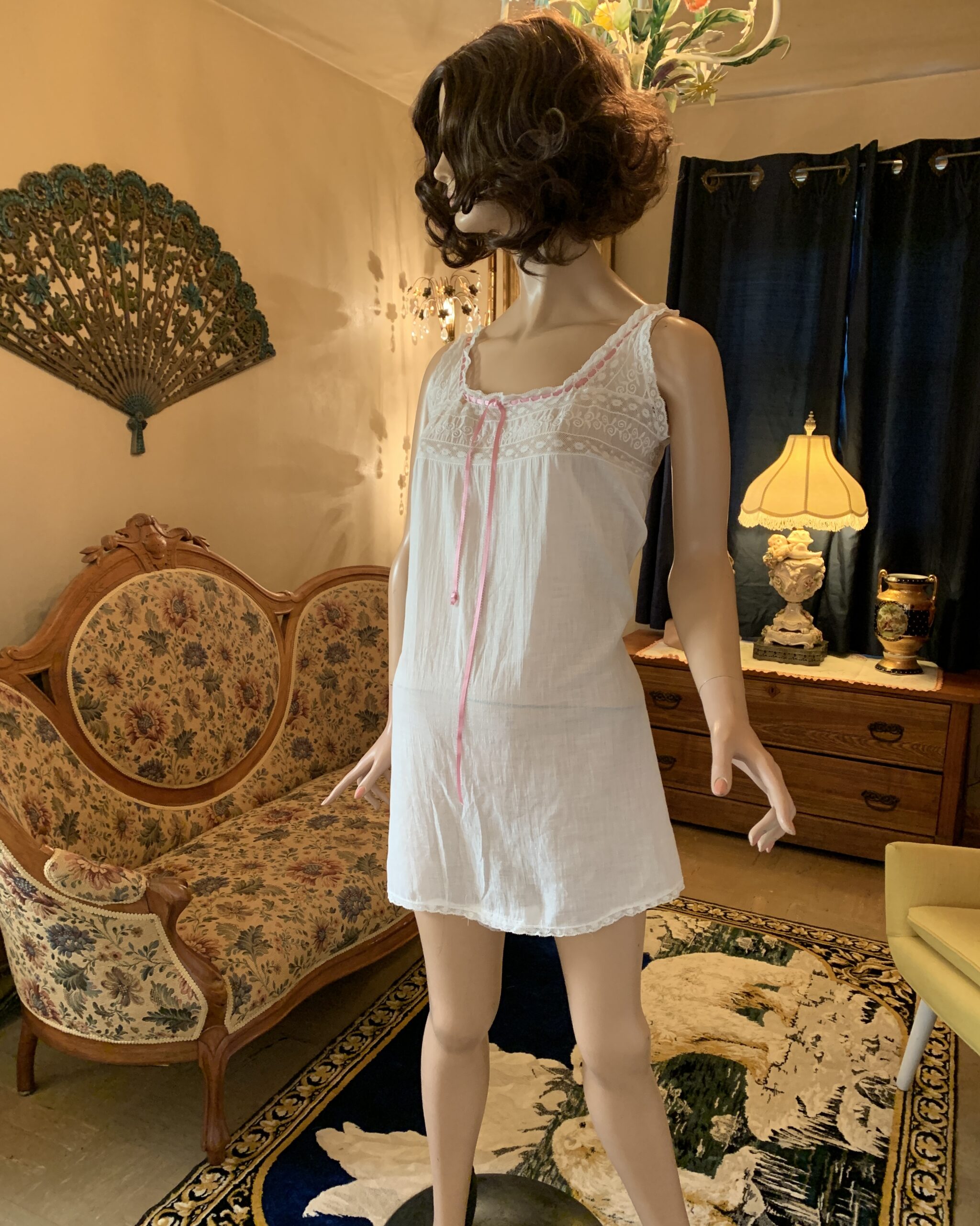 Antique Edwardian white cotton combination step-in displayed on mannequin with pink ribbon trim, lace insertion bodice, and lightweight cotton construction.