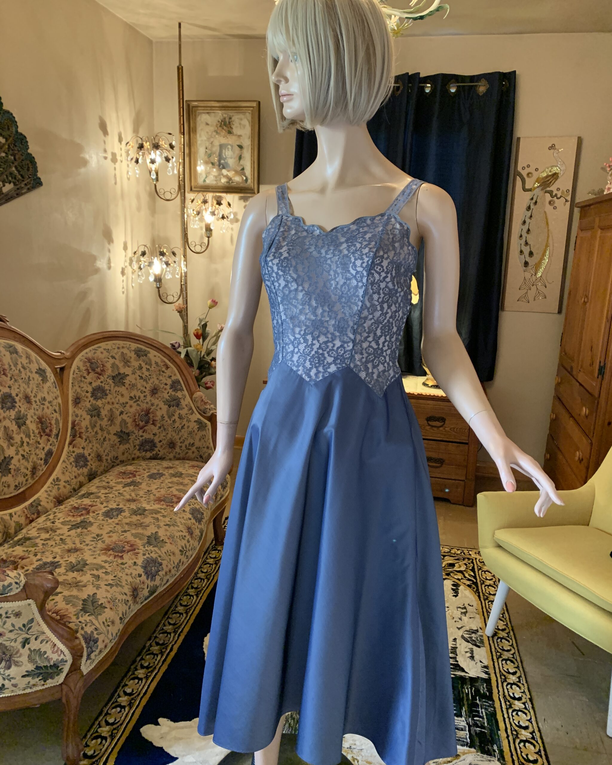 Vintage Barbizon Colette blue nylon slip dress with floral lace bodice and full skirt displayed on mannequin.