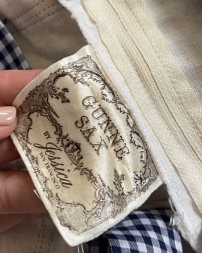 Close-up of original Gunne Sax by Jessica McClintock gold label and interior zipper detail.