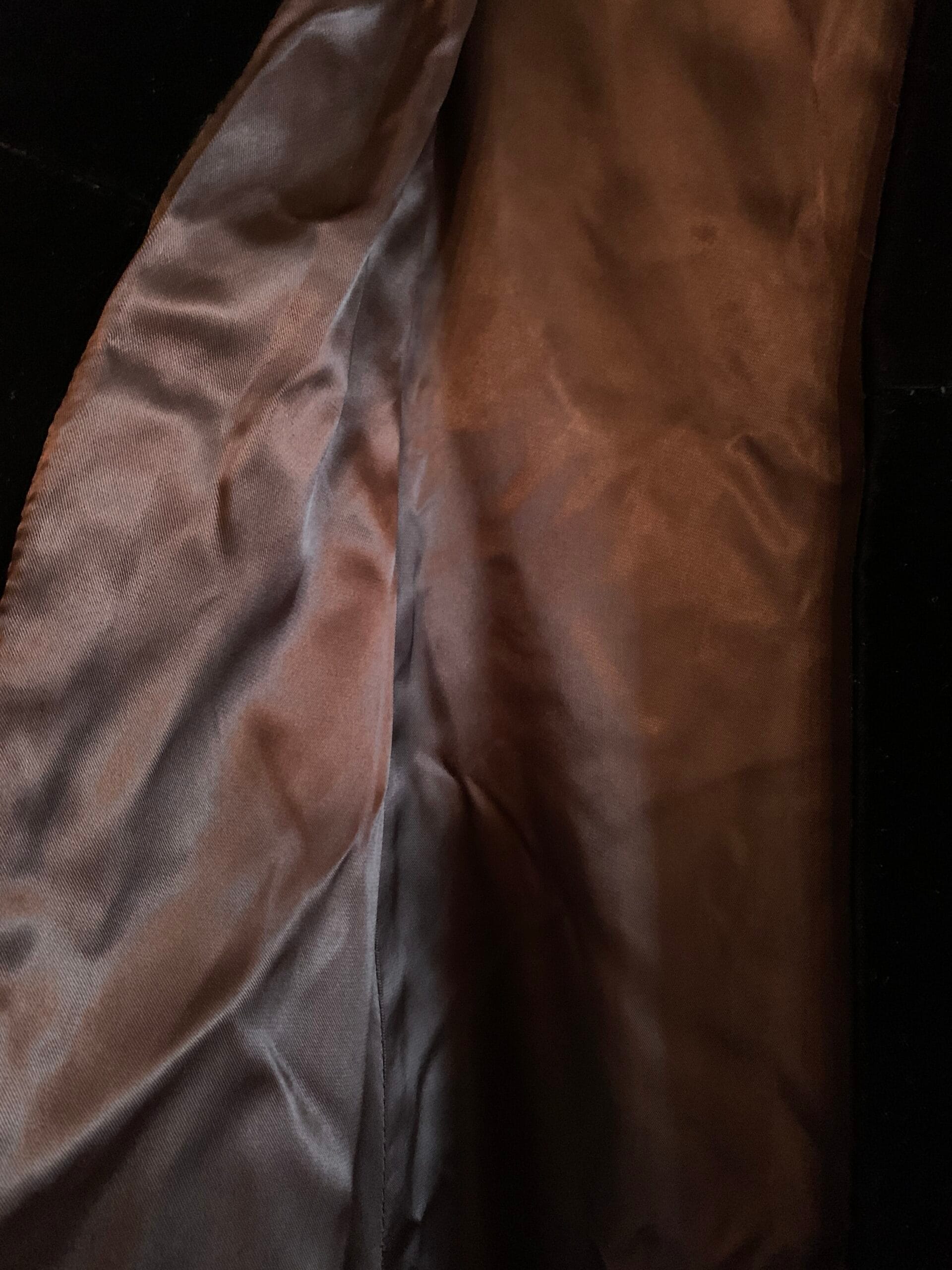 Brown satin lining inside black velvet opera coat.