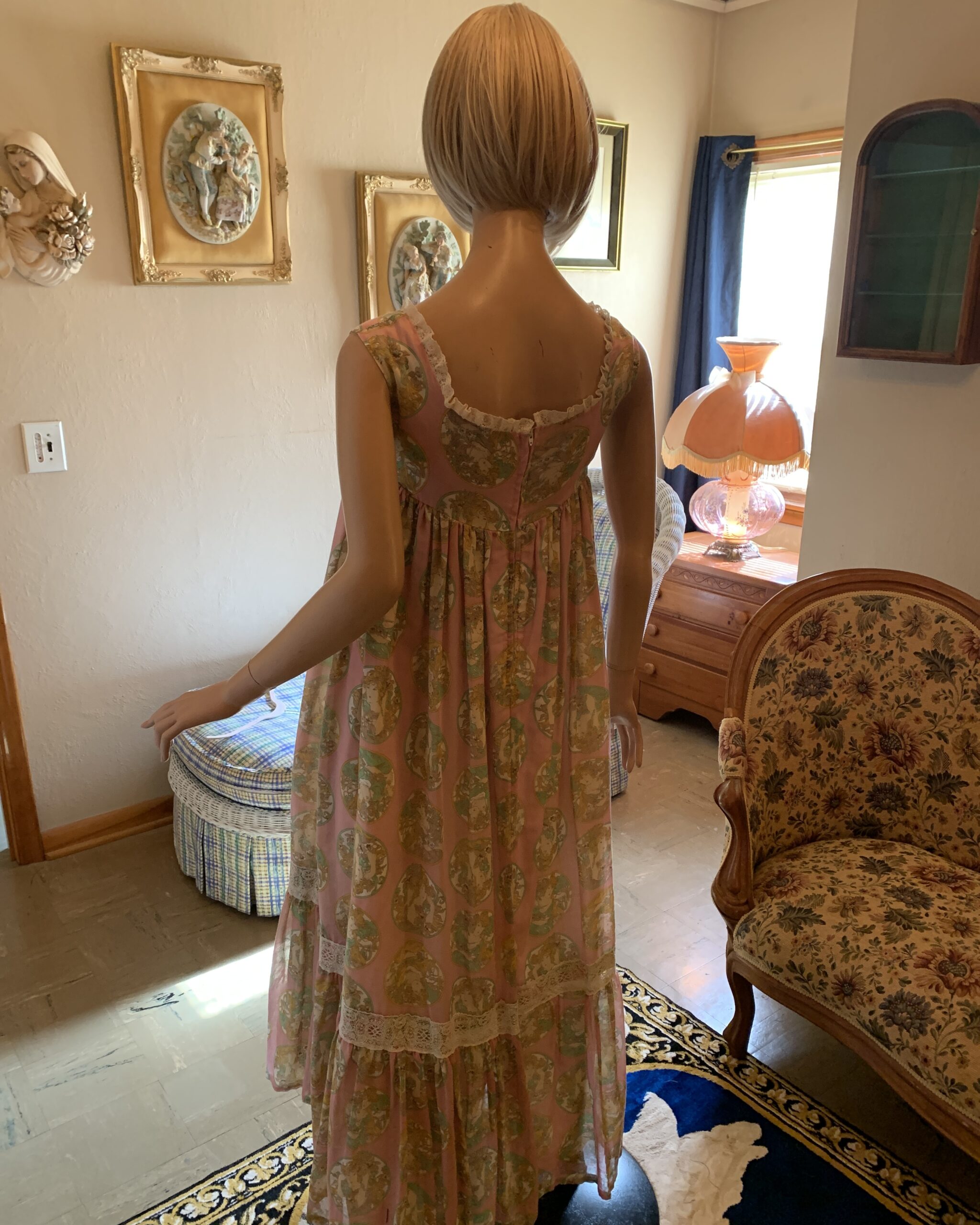 Back view of Susan Lane Mother Hubbard dress featuring gathered silhouette and lace-trimmed tiers.