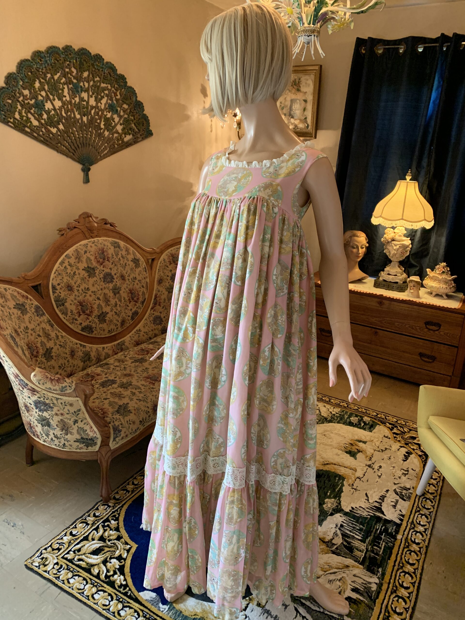 Susan Lane Mother Hubbard maxi dress in pink Art Nouveau portrait print with lace trim, front view.