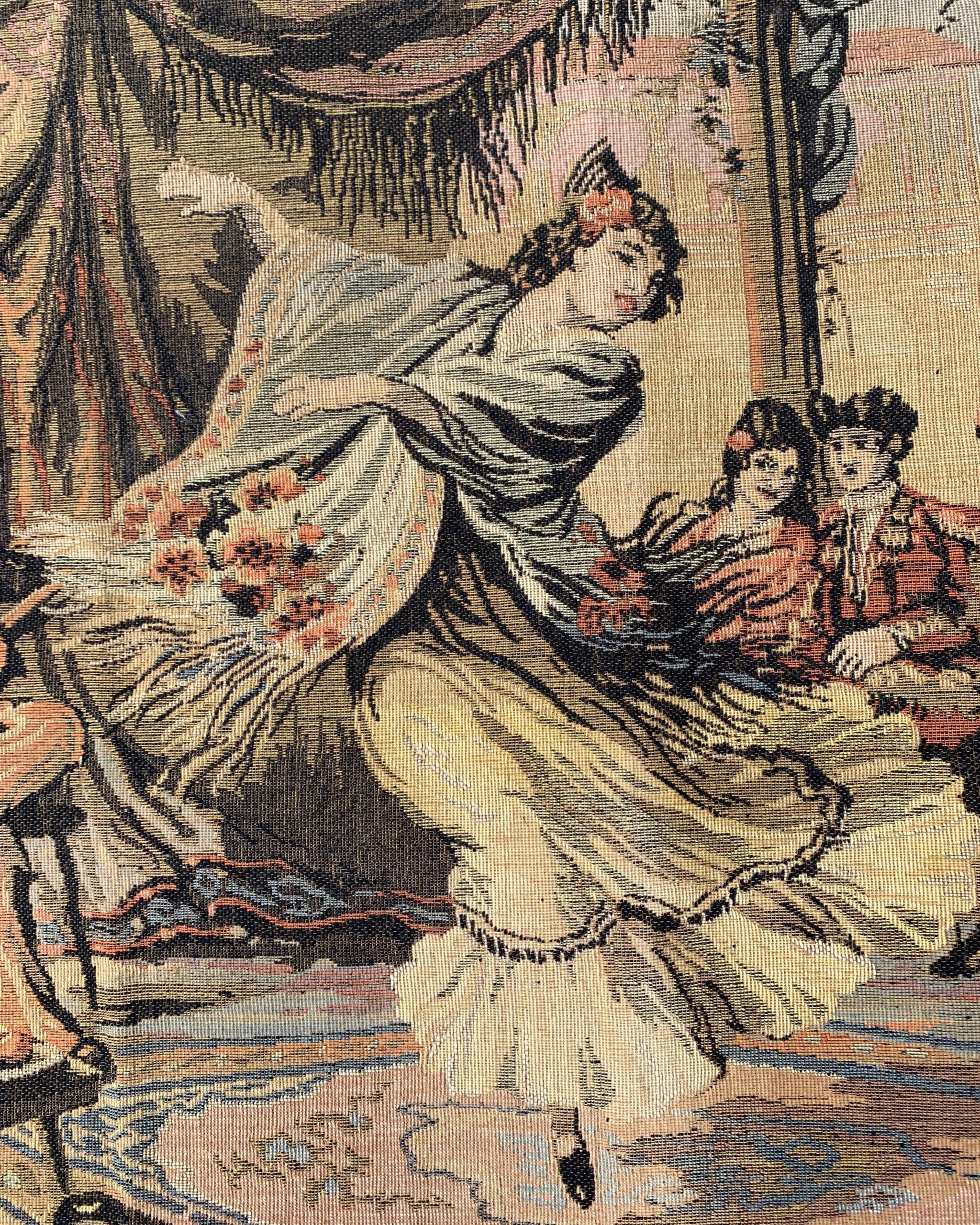 Close-up of central dancer figure woven into a vintage Spanish courtyard tapestry with flowing dress and floral accents.