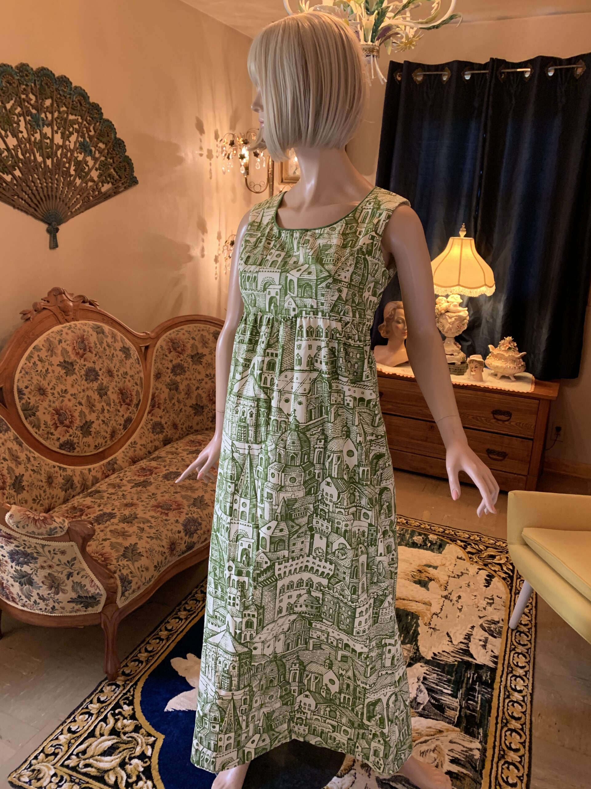 Handmade 1970s maxi dress in Waverly printed cotton featuring a green and ivory European cityscape print with church domes, rooftops, and winding streets.