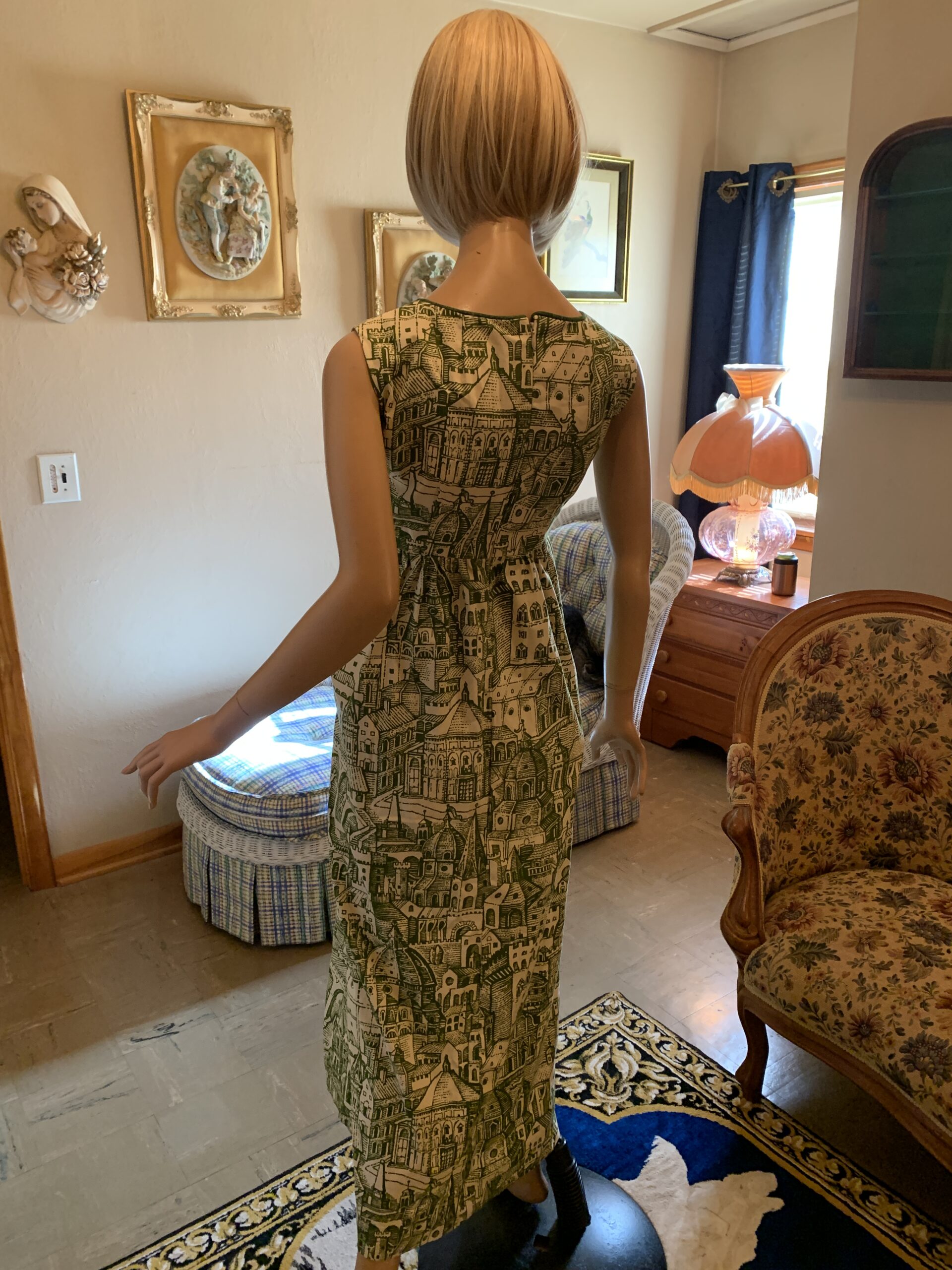 Back view of handmade Waverly cotton maxi dress with zipper closure and continuous old-world city print throughout the garment.