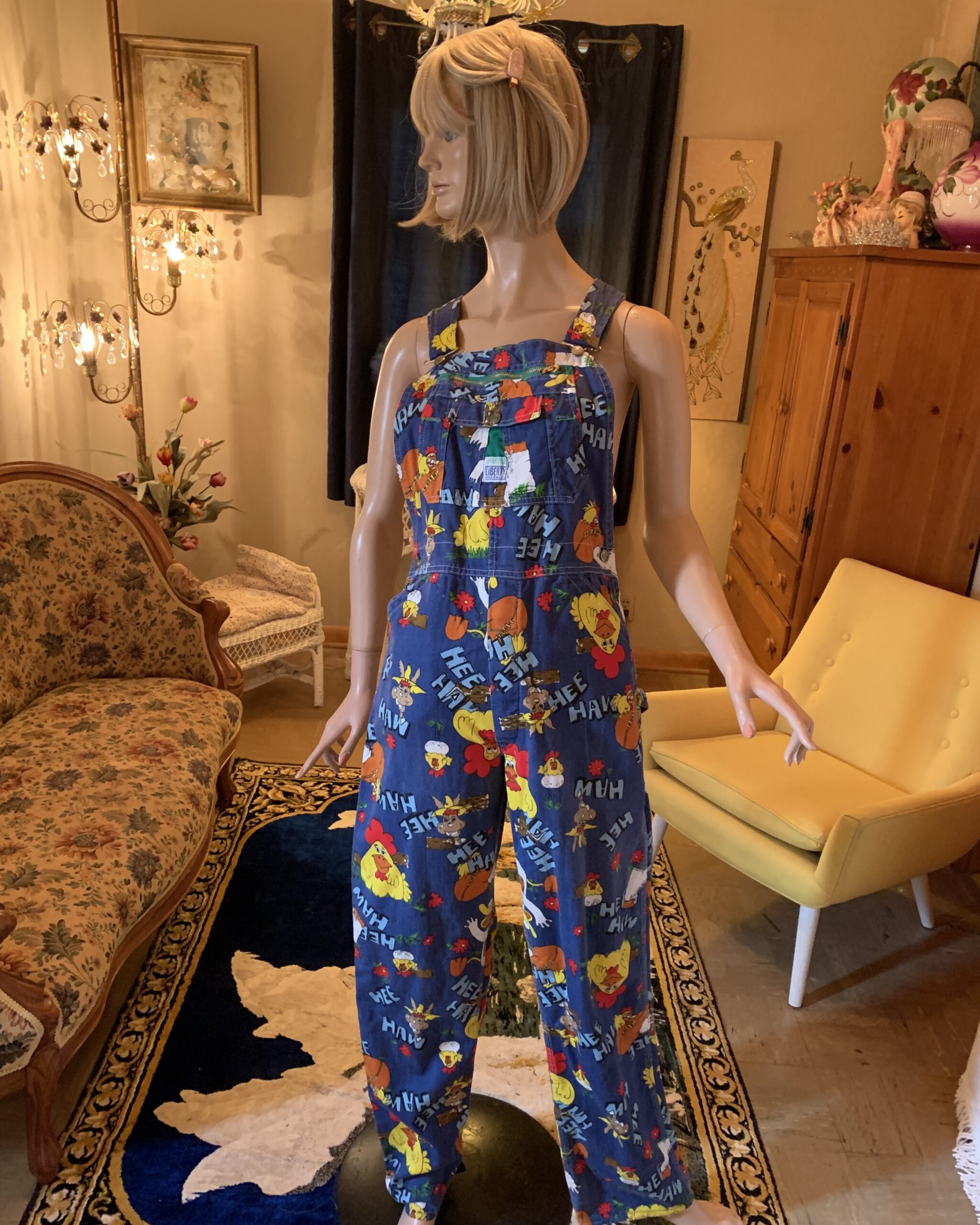 Vintage Liberty Hee Haw cotton bib overalls featuring colorful farm animal novelty print and zippered bib pocket.