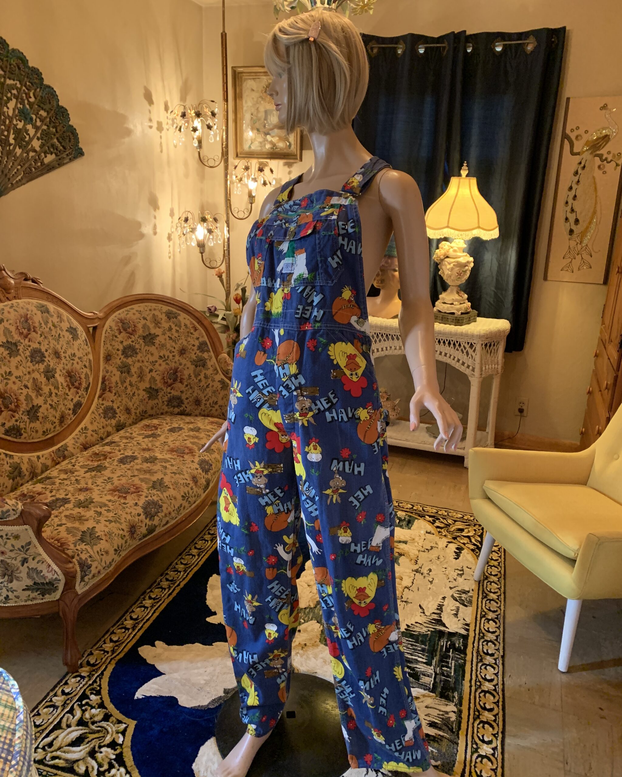 Vintage Liberty Hee Haw novelty print bib overalls with adjustable shoulder straps and button side closures.