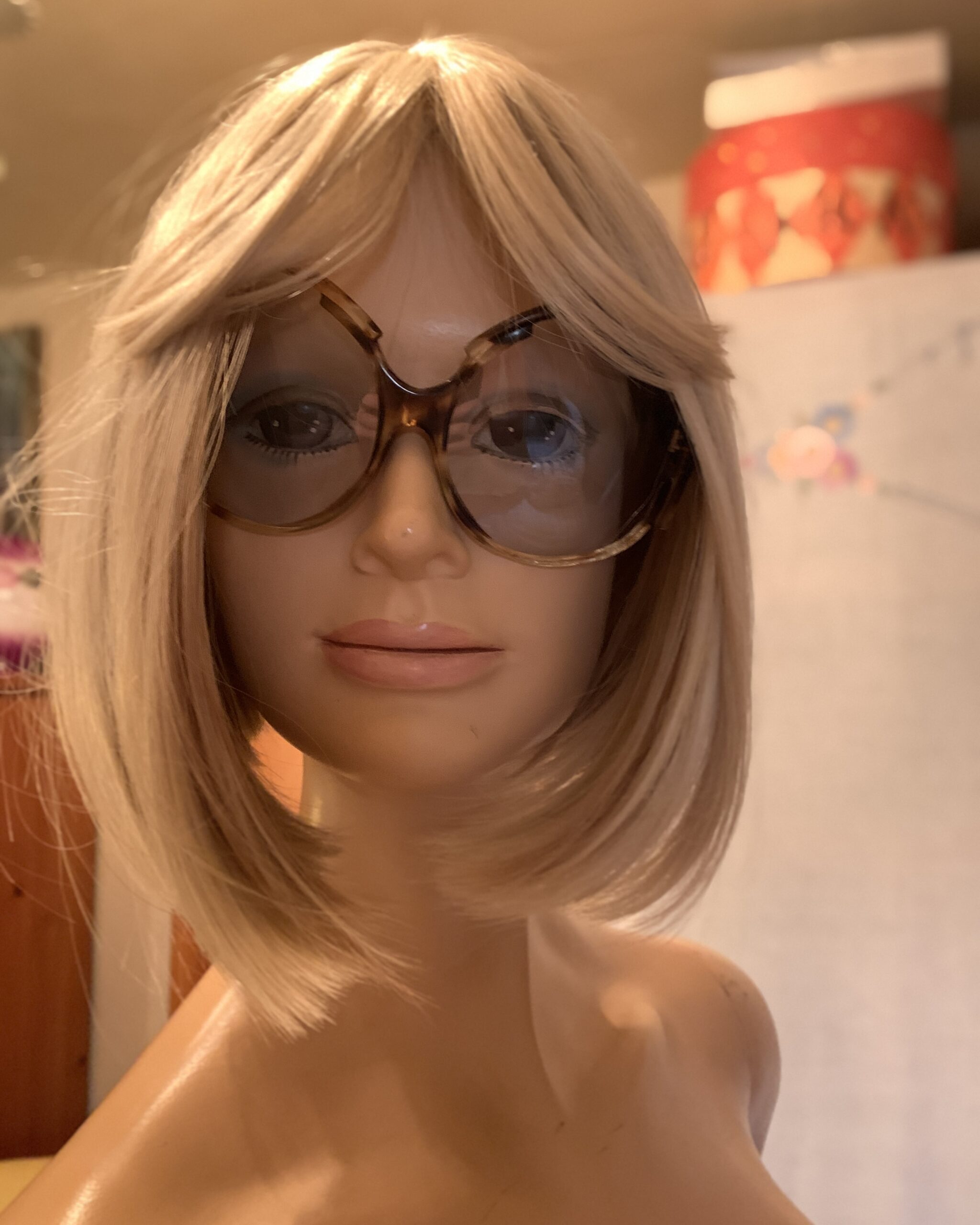 Vintage oversized tortoiseshell butterfly sunglasses with gray gradient lenses displayed on a blonde mannequin.