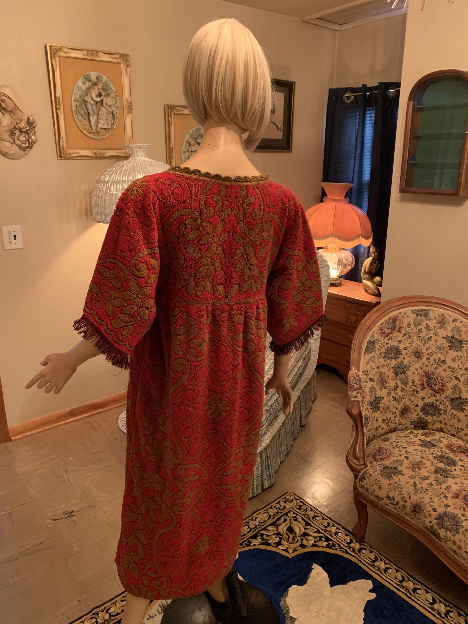 Vintage Cannon Cavalier terry cloth dress shown from the back with oversized floral and paisley pattern.