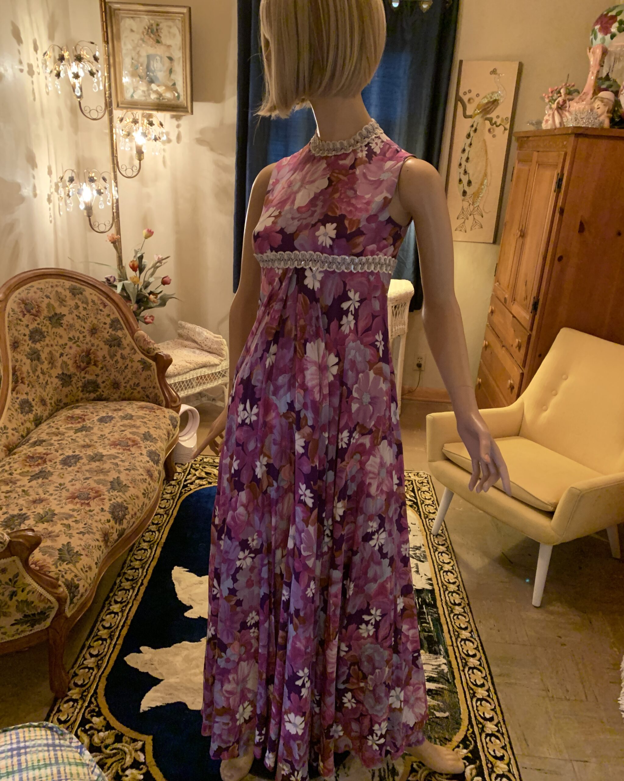 Front view of a handmade vintage Vogue Couturier palazzo jumpsuit in a purple, pink, and white floral print.