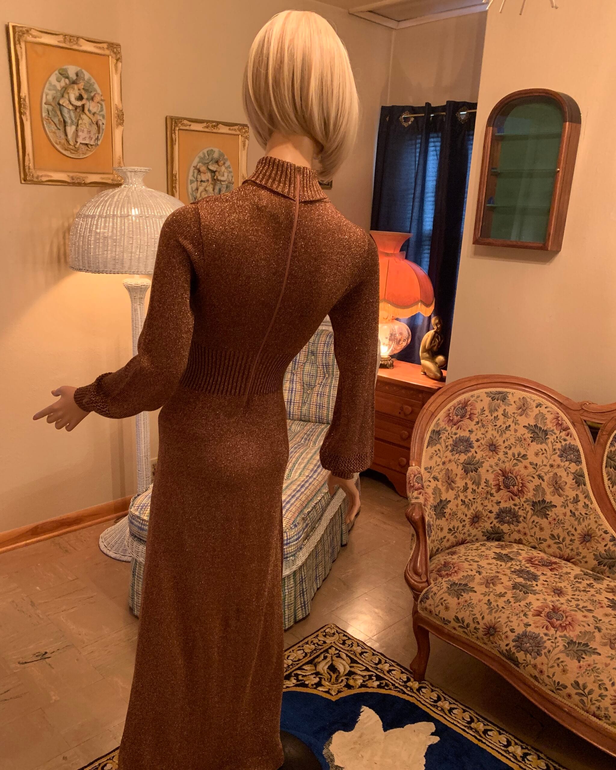 Back view of 1970s Wenjilli metallic knit maxi dress showing fitted ribbed waist and rear zipper