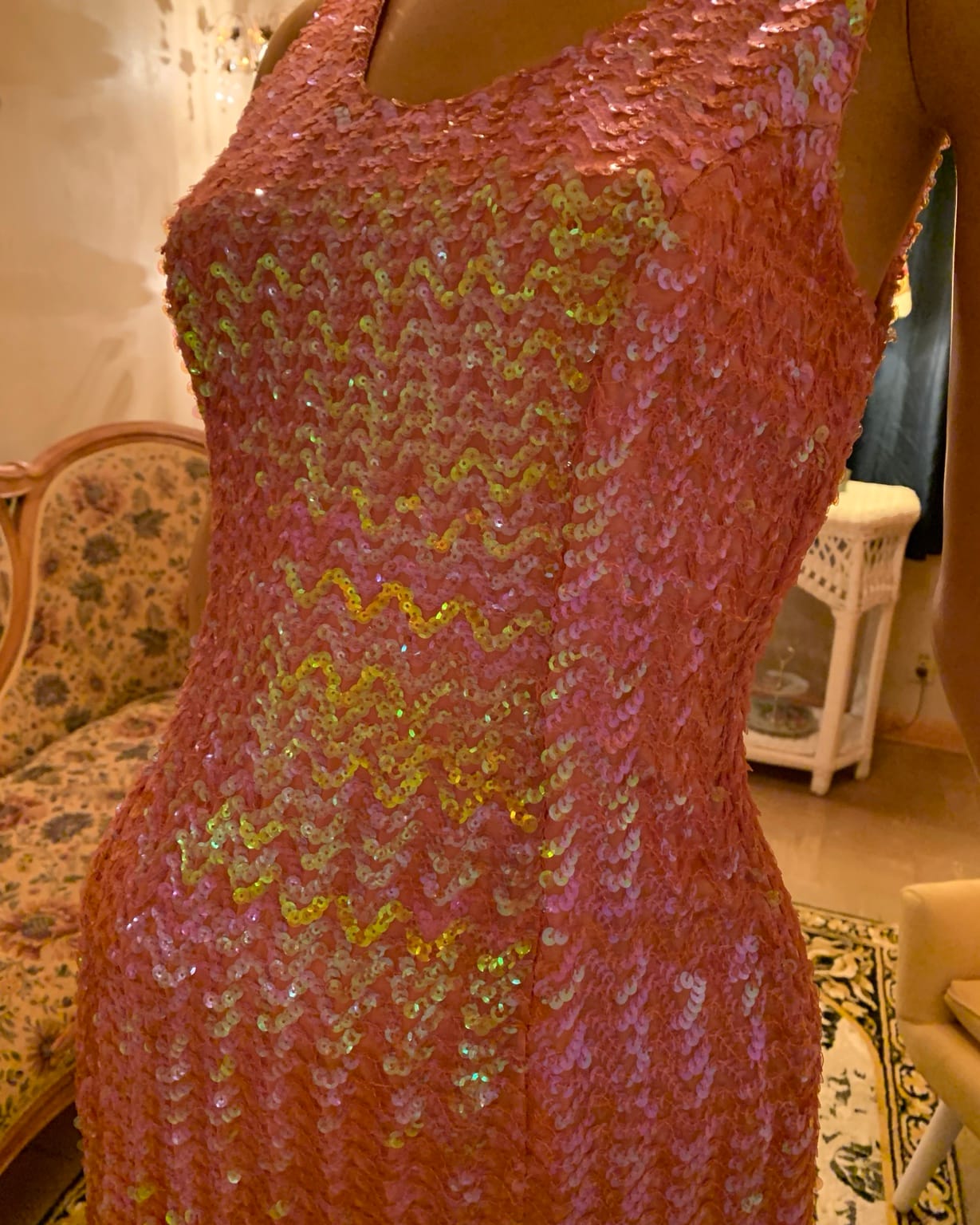 Close-up of pink and iridescent sequins on 1960s vintage cocktail dress