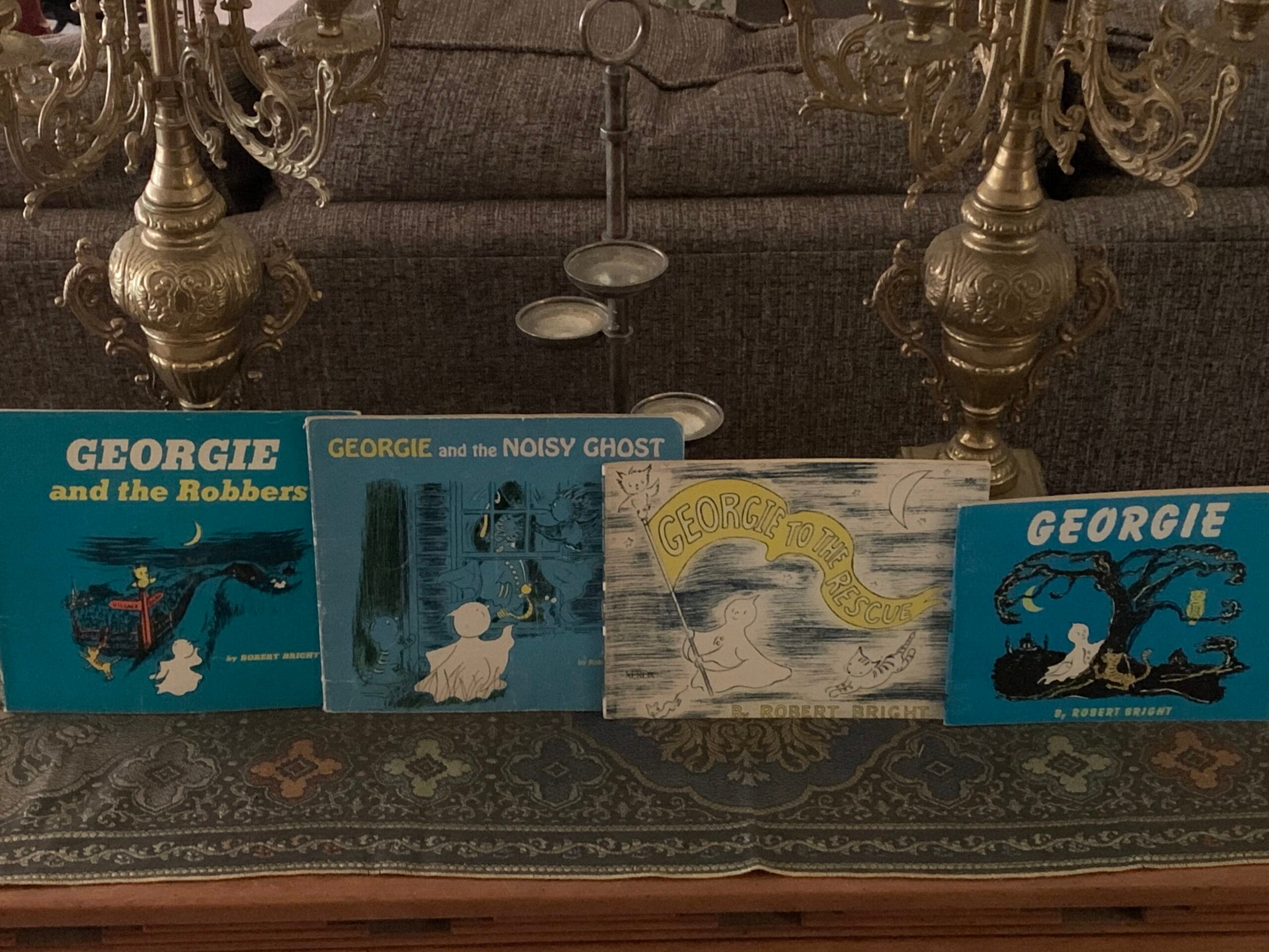 Four vintage Georgie the Ghost children’s books by Robert Bright displayed together, including Georgie and the Robbers and Georgie and the Noisy Ghost.